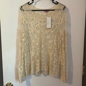 Cream white lace top.